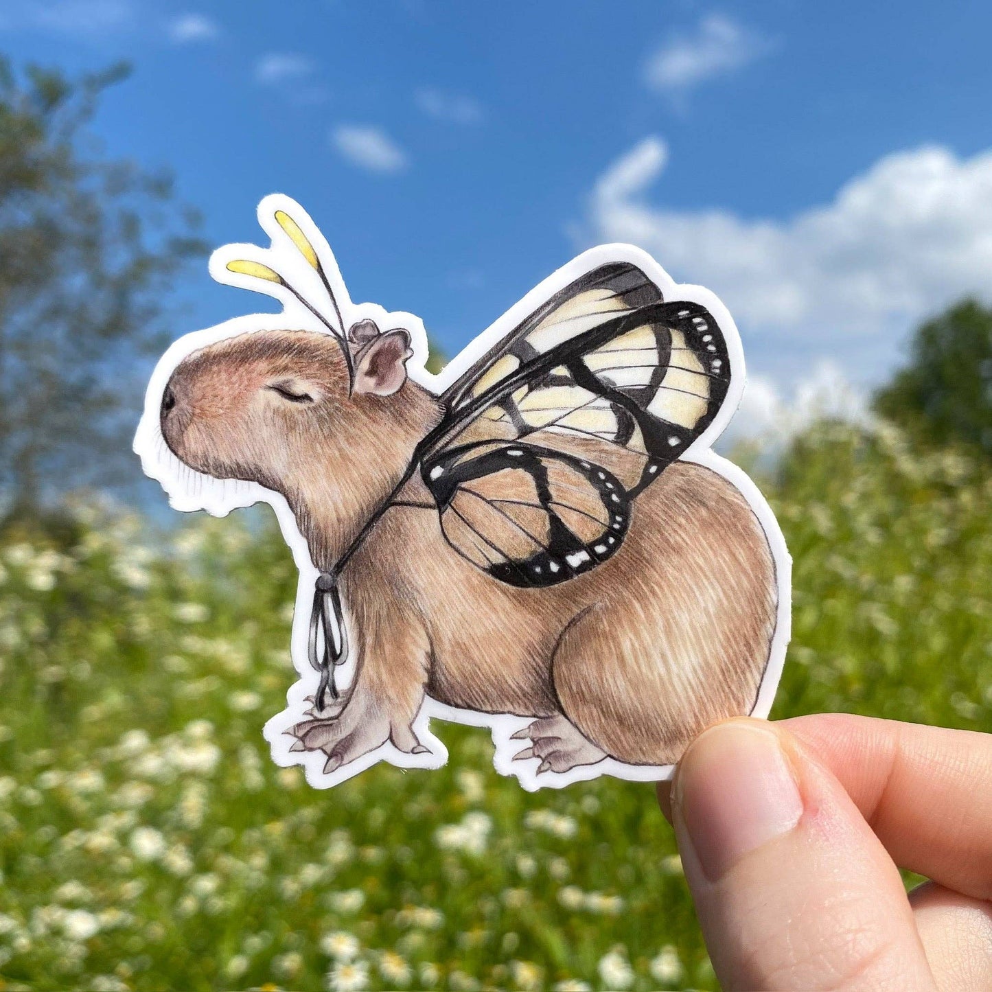 Pegatina de vinilo resistente a la intemperie con diseño de mariposa y capibara