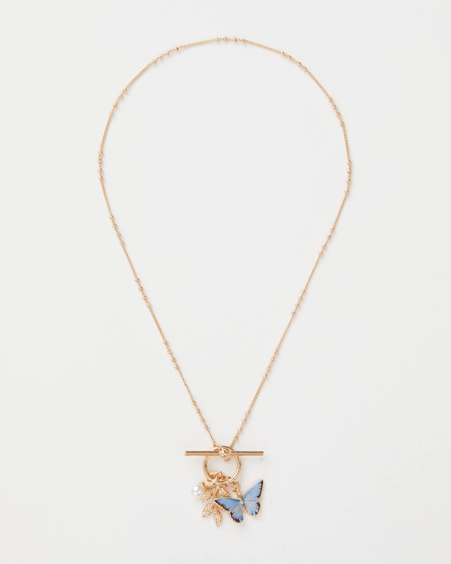 Collar con dije de mariposa y hoja de esmalte azul